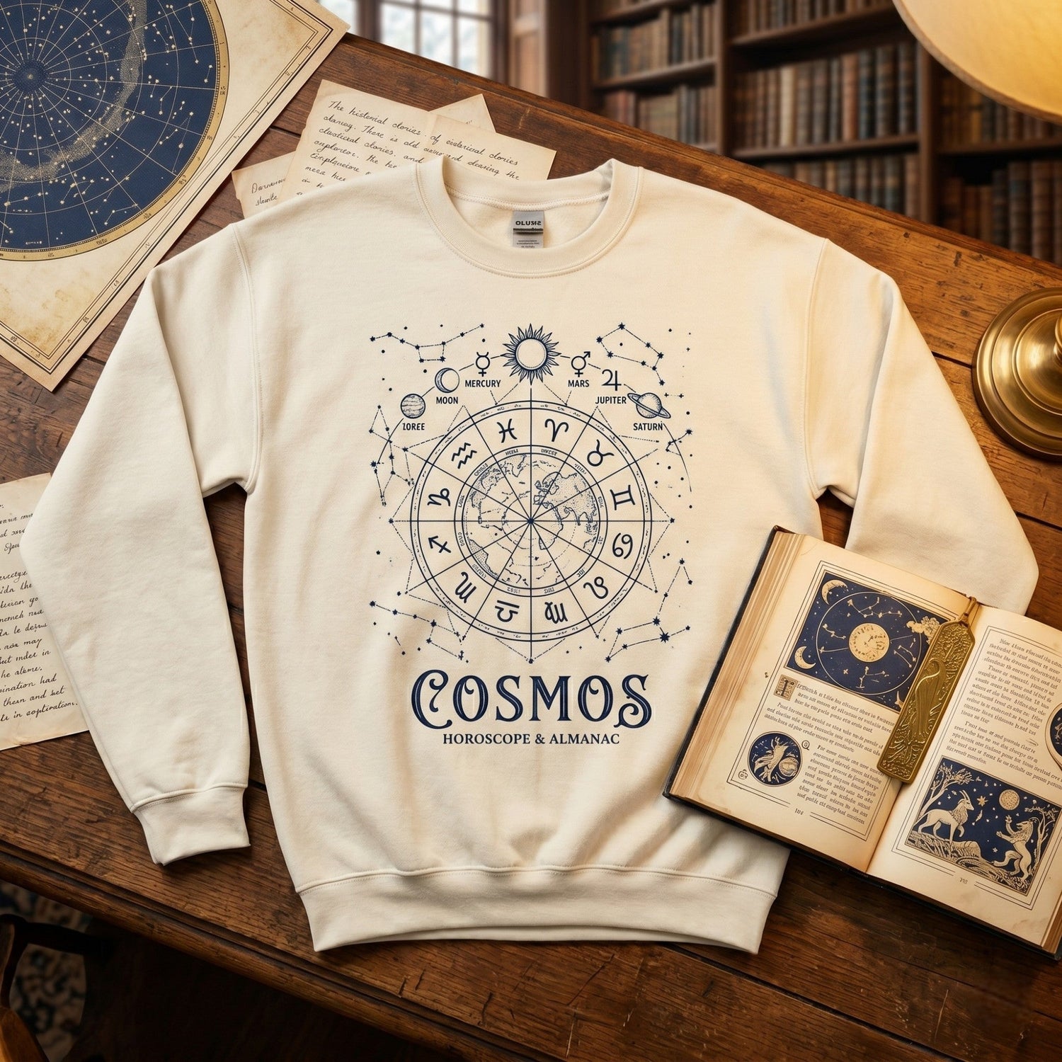 Spiritual clothing and inspirational apparel collection featuring a celestial sweatshirt styled with books, star charts, and vintage illustrations.